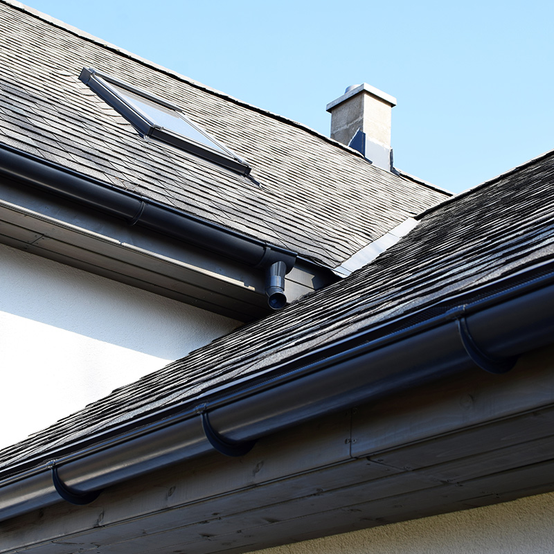 residential property roof close up with metal gutter and asphalt shingles roof installed beaverton or